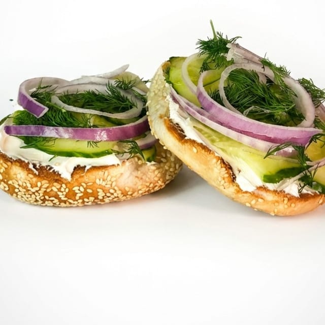 Bagel with cream cheese and cucumber.